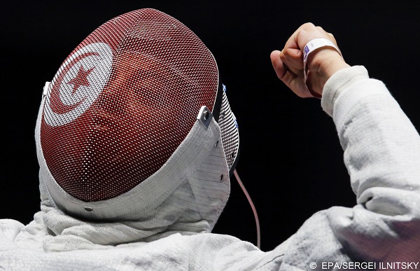 epa05464783 Azza Besbes of Tunisia reacts during her women's Sabre individual quarter final bout against Manon Brunet of France at the Rio 2016 Olympic Games Fencing events at the Carioca Arena 3 in the Olympic Park in Rio de Janeiro, Brazil, 08 August 2016.  EPA/SERGEI ILNITSKY
