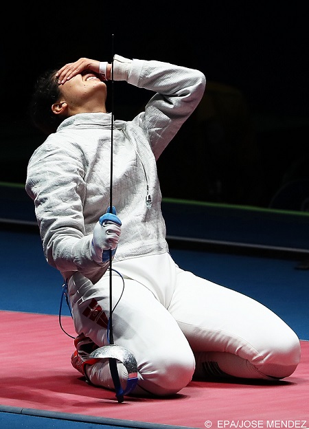 epa05464791 Azza Besbes of Tunisia reacts after losing her women's Sabre individual quarter final bout against Manon Brunet of France at the Rio 2016 Olympic Games Fencing events at the Carioca Arena 3 in the Olympic Park in Rio de Janeiro, Brazil, 08 August 2016.  EPA/JOSE MENDEZ