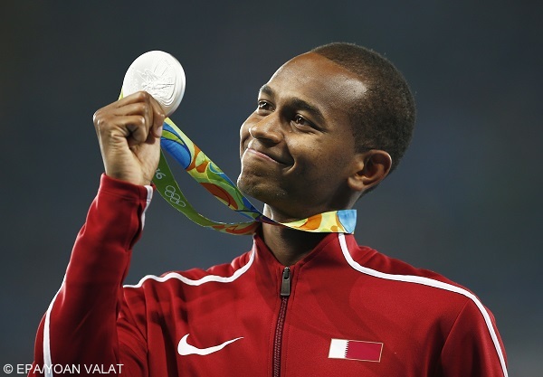 epa05494515 Silver medalist Mutaz Essa Barshim of Qatar during the medal ceremony for the men's High Jump of the Rio 2016 Olympic Games Athletics, Track and Field events at the Olympic Stadium in Rio de Janeiro, Brazil, 17 August 2016.  EPA/YOAN VALAT
