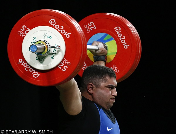 epa05491174 Ahmed Mohamed of Egypt makes an attempt during the men's +105kg competition of the Rio 2016 Olympic Games Weightlifting events at the Riocentro in Rio de Janeiro, Brazil, 16 August 2016.  EPA/LARRY W. SMITH