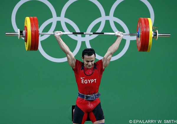 epa05466360 Ahmed Saad of Egypt makes an attempt during the men's 62kg group A category of the Rio 2016 Olympic Games Weightlifting events at the Riocentro in Rio de Janeiro, Brazil, 08 August 2016.  EPA/LARRY W. SMITH