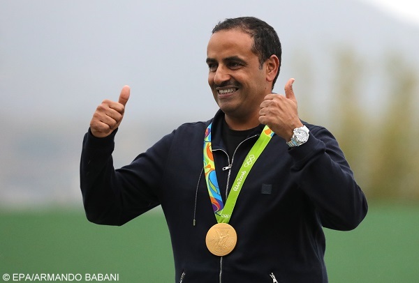 epa05471572 Fehaid Aldeehani of the IOA poses with his gold medal on the podium after winning  the Rio 2016 Olympic Games Men's Double Trap Shooting event at the Olympic Shooting Centre in Rio de Janeiro, Brazil, 10 August 2016.  EPA/ARMANDO BABANI