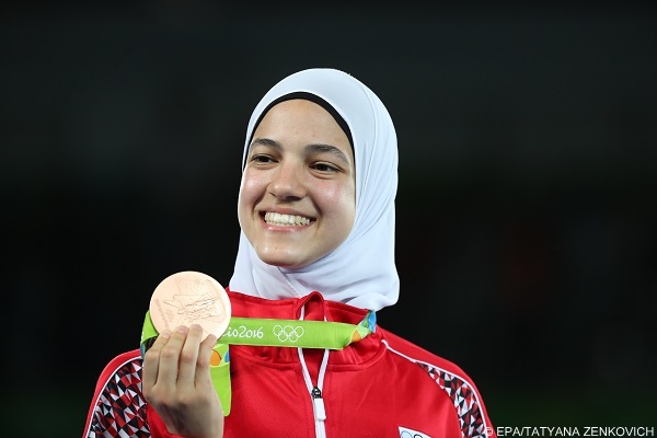 epa05498324 Joint bronze medalist Hedaya Wahba of Egypt poses on the podium for the women's -57kg competition of the Rio 2016 Olympic Games Taekwondo events at the Carioca Arena 3 in the Olympic Park in Rio de Janeiro, Brazil, 18 August 2016.  EPA/TATYANA ZENKOVICH