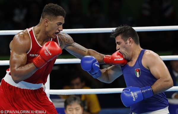epa05490036 Tony Victor James Yoka (L) of France and Hussein Iashaish of Jordan in action during their men's Super Heavy quarterfinal bout of the Rio 2016 Olympic Games Boxing events at the Riocentro in Rio de Janeiro, Brazil, 16 August 2016.  EPA/VALDRIN XHEMAJ