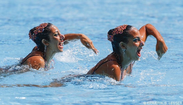 epa05487303 Samia Ahmed and Dara Hassanien of Egypt perform during the synchronised swimming duets technical routine of the Rio 2016 Olympic Games Synchronised Swimming events at the Maria Lenk Aquatics Centre in the Olympic Park in Rio de Janeiro, Brazil, 15 August 2016.  EPA/ERIK S. LESSER